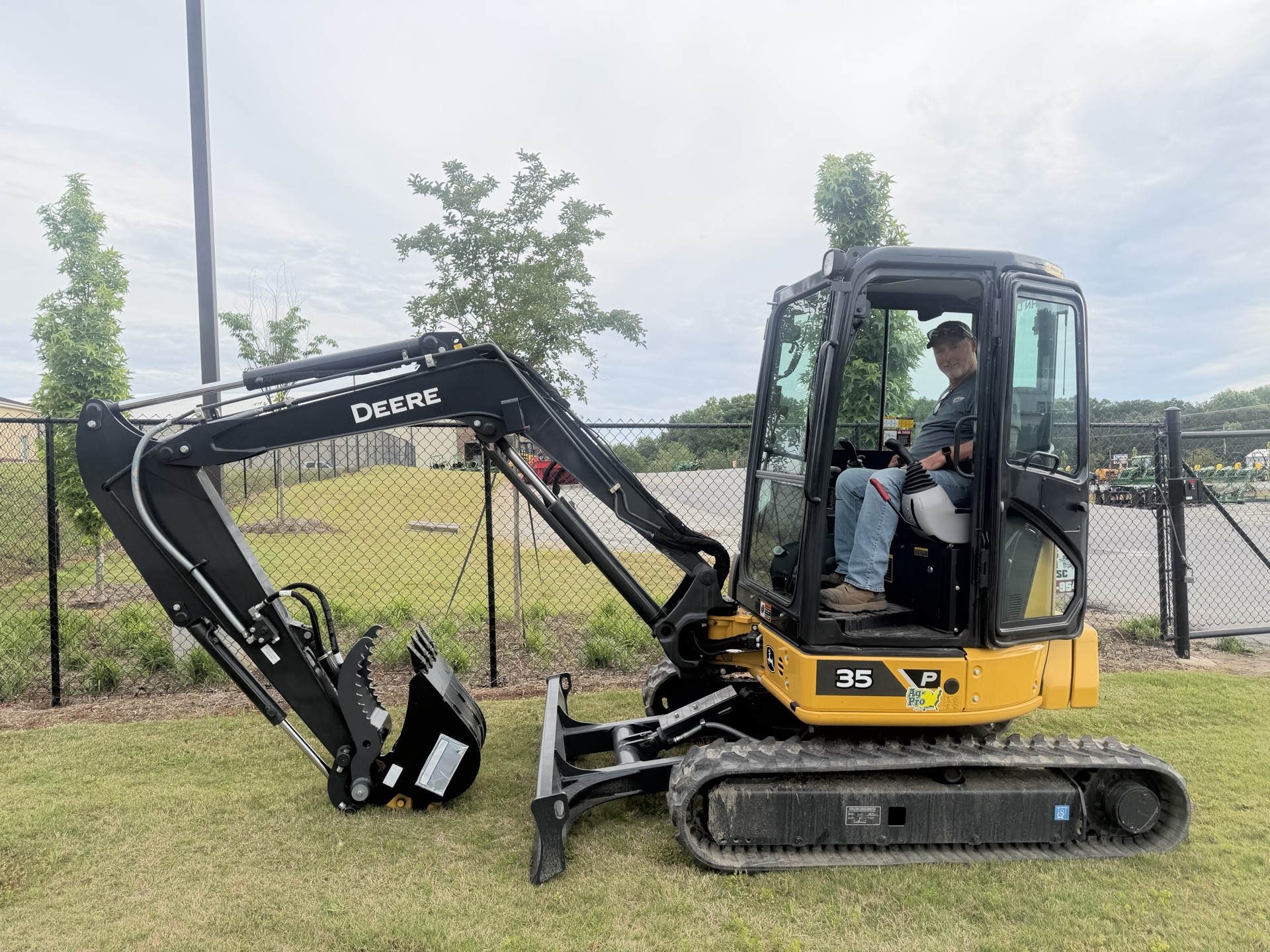 Brock in the cab of his John Deere 35P mini excavator