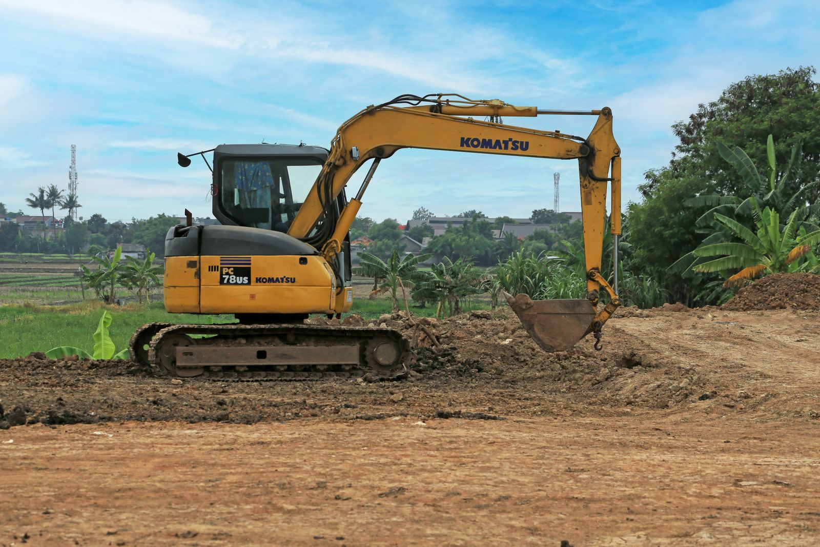 Mini excavator grading a lot in the Upstate